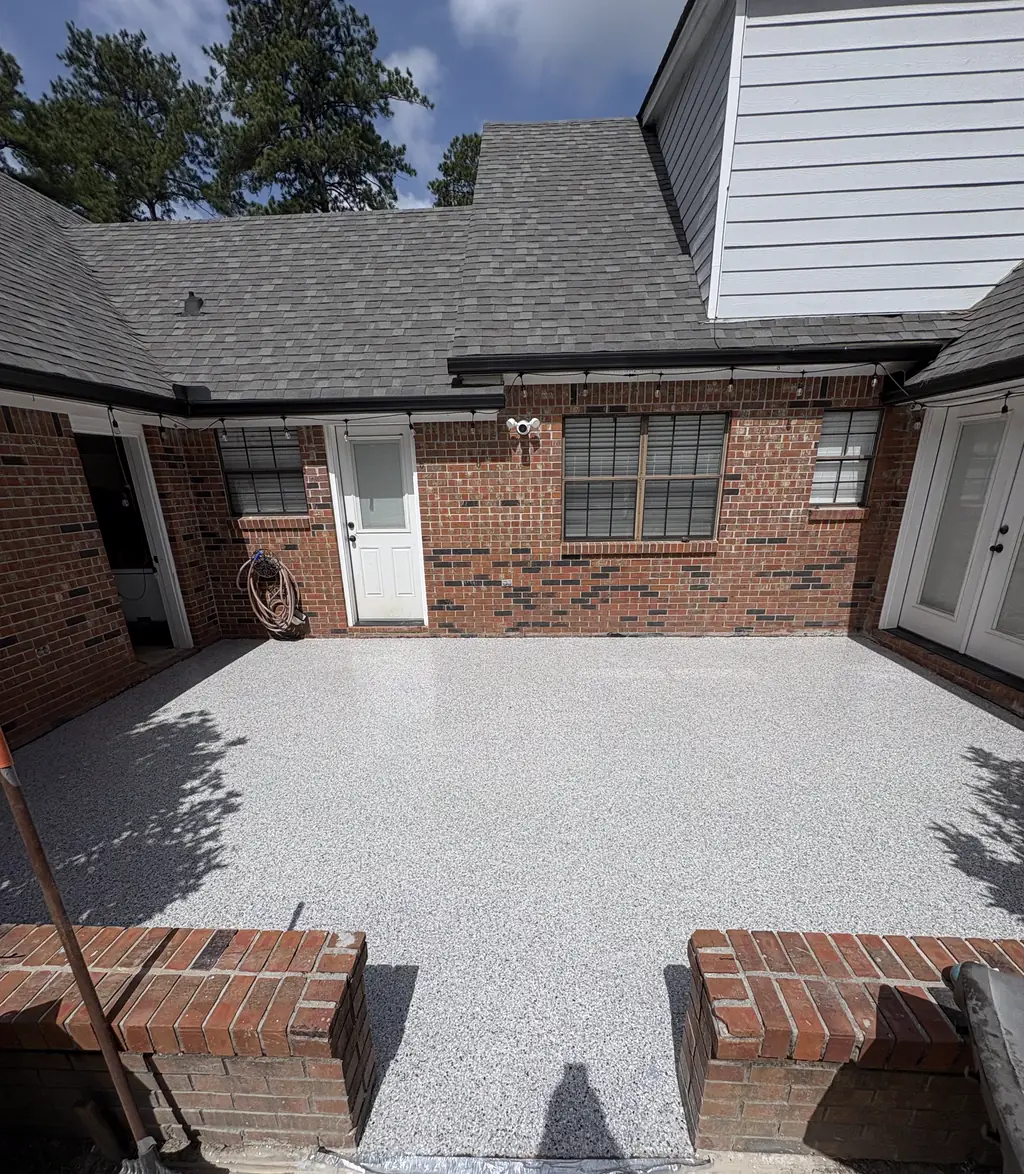 Brick courtyard patio coated in light gray and white flake